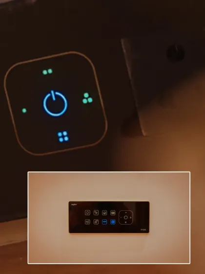 A close-up of one of our smart panels, showing the clean, illuminated icons. This particular panel includes a master power button and controls for multiple light groups.