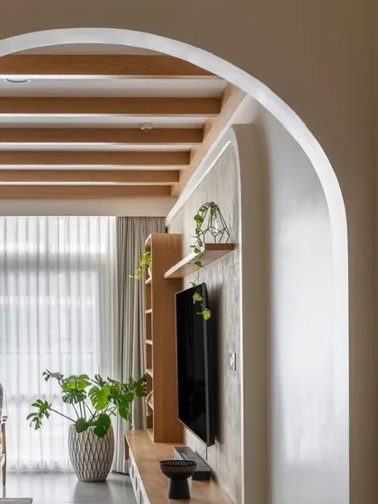 An artful detail shot of the arched entryway, showing the beautiful curves and the way light falls in the 'Cover me in Sunshine' home.