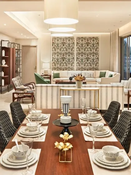 The open-plan living and dining area of the Max128 apartment, designed for modern Indian living.