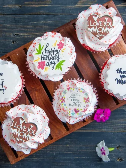 A box of our special Mother's Day Red Velvet Cupcakes. Each cupcake is topped with a sweet, heartfelt message for Mom.