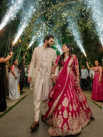 A grand Sangeet entrance with sparklers. We capture the energy and excitement of your celebrations, creating dynamic and memorable shots of your big moments.