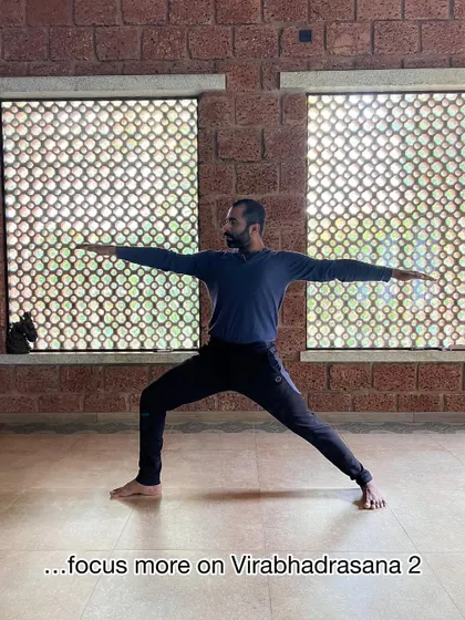 If opening the hips in Trikonasana or Parsvakonasana is a challenge, spend more time focusing on Virabhadrasana II. This foundational pose builds the necessary strength and openness.