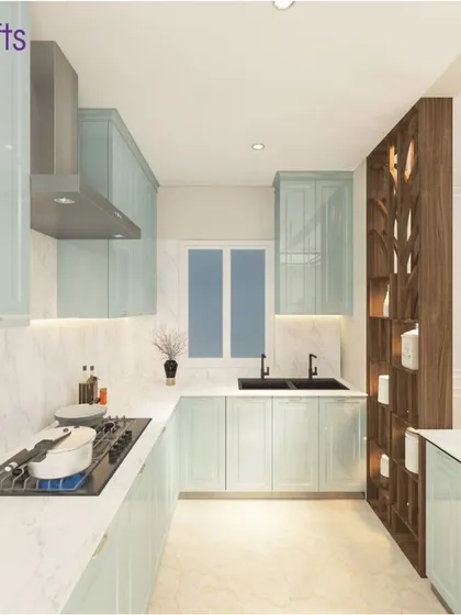 The kitchen from our 'Heritage County' villa project. It features beautiful pastel blue cabinets, a white marble backsplash, and a unique wooden partition with display shelves.
