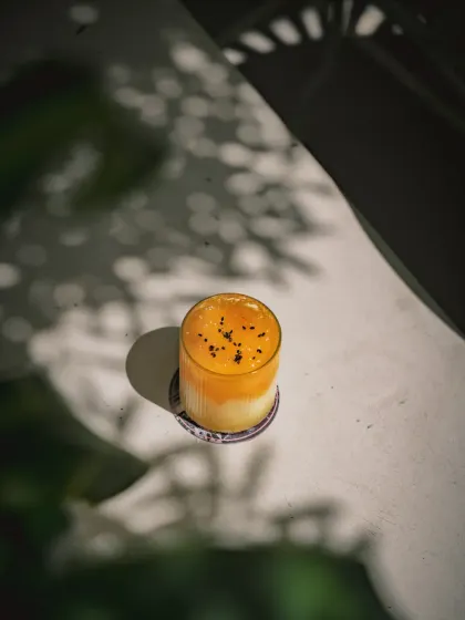 I’ve always loved flipping the script. My Mango Sticky Rice isn’t a dessert, it’s a drink that sips like a memory. Jasmine rice, coconut milk, and juicy mango are clarified into something smooth, nostalgic, and stunning.