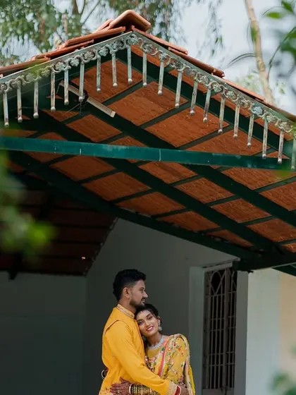 A quiet moment between the couple on the porch of a traditional house during their Haldi ceremony.