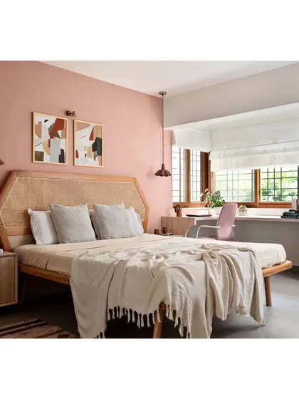 The second guest bedroom, featuring a pastel earthy peach color palette. The balcony was extended into the room, and end-to-end windows were installed to create a bright and airy space.