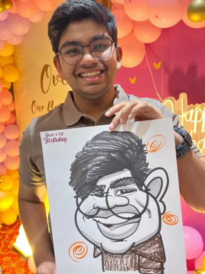 This young man's happy reaction is what it's all about. The party decorations add to the festive feel of the photo.