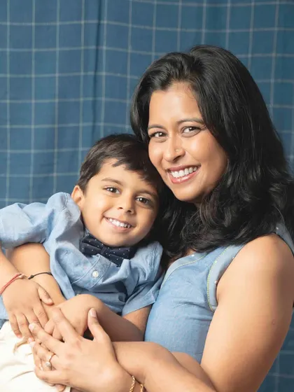 A sweet and gentle moment between mother and son. This close-up portrait beautifully captures their loving expressions and the strong bond they share.