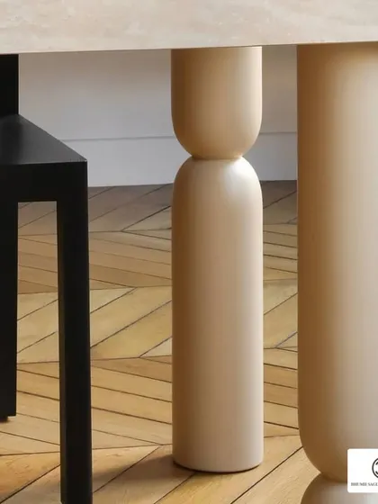 The legs of a table can be a design statement. These uniquely shaped, rounded table legs in a light wood finish add a playful and modern touch to the dining space.
