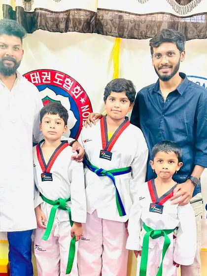 Posing with students and their families after the belt ceremony.