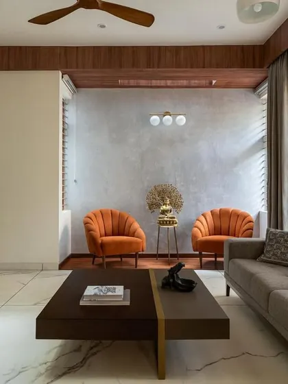 This living room from the 'Chirantana' residence shows how minimalist design can be warm and inviting. I focused on clean lines, a mix of wood and concrete textures, and a layout that complements the home's modern architecture.