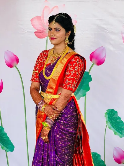 A side profile of the Pellikuthuru look, showing off the elegant hairstyle and the way the makeup complements her features.