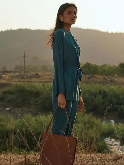 Using the golden hour light to create a warm, windswept portrait. The landscape becomes an essential part of the story, adding a sense of freedom and space.