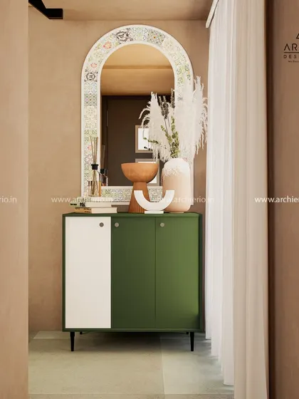 A simple yet chic console table in a rustic-contemporary setting. The olive green cabinet and decorative mirror add a touch of color and personality.