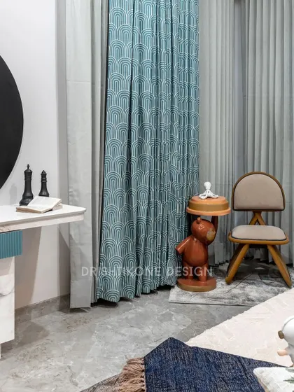 A detail shot of the playful yet elegant corner in the kid's room. The space features a whimsical bear-shaped side table and a stylish chair, perfectly complementing the room's creative and modern aesthetic.