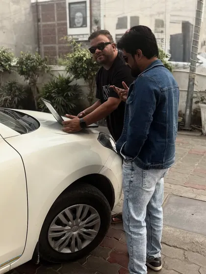 Another shot from the road, working on music on the hood of a car. The hustle never stops.
