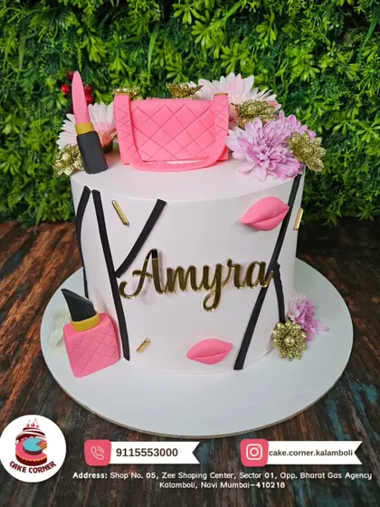 A chic makeup-themed cake for Amyra. The design features a pink handbag, lipstick, and flowers, combining fashion and beauty.