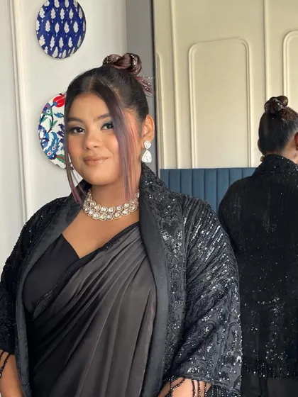 This look is all about confidence. The high bun and sequined jacket create a powerful silhouette, and I love how it all came together.
