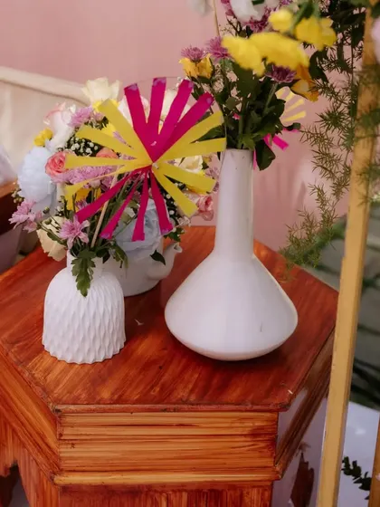 A close-up of the colorful pinwheel and fresh flower arrangements that added a playful touch to the Mehendi Mela.