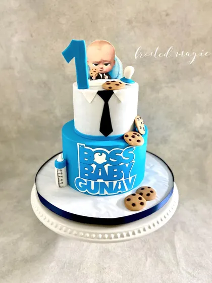 Here is a cake for the little boss in the house! This Boss Baby themed cake is perfect for a first birthday, complete with the signature suit, tie, and of course, cookies.