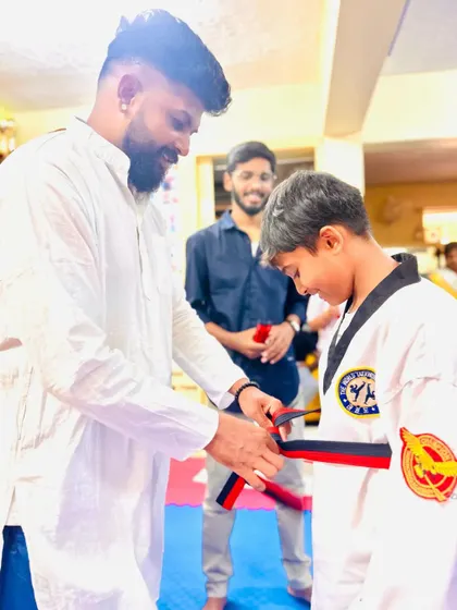 A moment of achievement for this young martial artist.