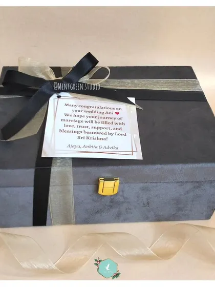 A sophisticated grey suede box used for a wedding congratulations hamper. The classic look is perfect for such an elegant occasion.