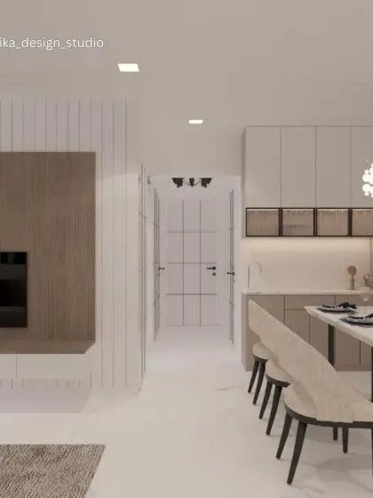 This image shows the seamless transition from the living area to the dining space and kitchen. The consistent use of light wood tones and off-white finishes creates a harmonious flow between the different functional zones of the home.