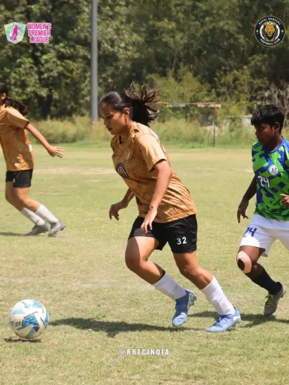 Our player on the attack, dribbling at speed and looking to create a scoring opportunity while being pursued by defenders.