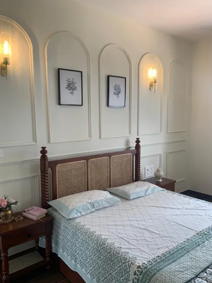 When your decor game is so strong, it deserves its own Pinterest board. This bedroom features elegant wall moulding, a classic four-poster bed, and beautiful lighting.