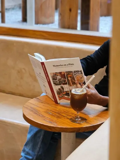 Enjoying 'Memories on a Plate' with a coffee at a cafe.