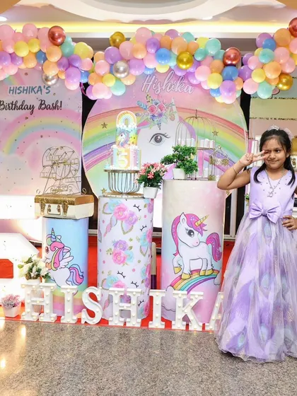 The birthday girl enjoying her unicorn-themed fifth birthday bash. Seeing the joy on their faces is the best part of what we do.