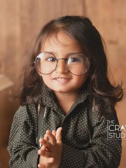 The cutest little professor. Wearing oversized glasses, this toddler looks ready to share his wisdom.