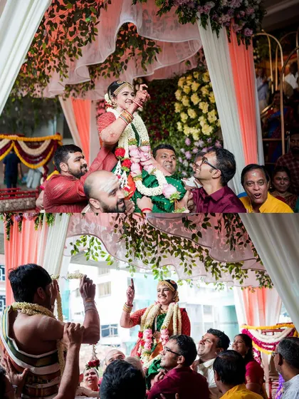 The bride being carried by her brothers during the garland exchange ceremony. This moment is full of laughter, family bonding, and friendly competition.