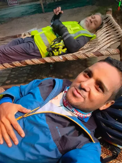 A rare moment of rest on a charpai at a roadside dhaba during the sleepless 36-hour ride.