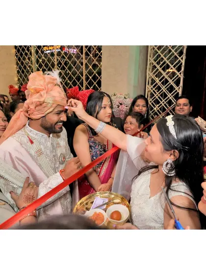 The groom's entry, with the ribbon-cutting ceremony, a fun tradition.