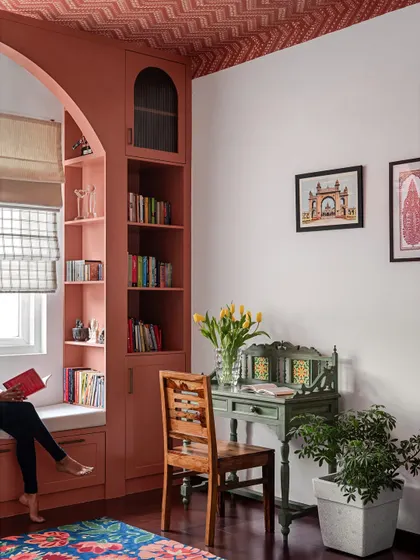I believe every home needs a quiet corner for reflection. We created this cozy window seat and reading nook with custom-built shelving, turning an unused space into a personal haven for getting lost in a book.