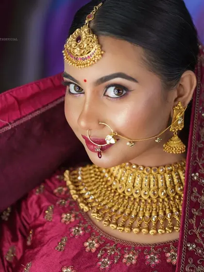 A happy and engaging portrait. The makeup enhances her natural beauty and her bright, expressive eyes.