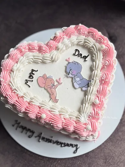 A sweet and funny anniversary cake featuring Tom & Jerry. It's a playful twist on a romantic celebration, perfect for a couple who loves to laugh together.