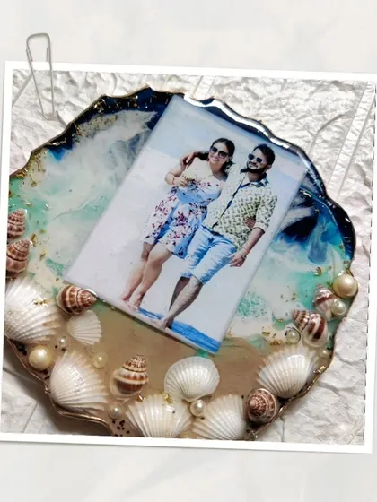 More views of the custom ocean themed photo frame. The layers of resin create a realistic wave effect, and the real seashells add a beautiful, tactile element to the piece.