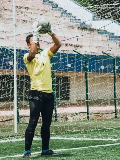 Goalkeeper Akash Kola confidently catching the ball. His development into a top-tier keeper is a highlight of our program.