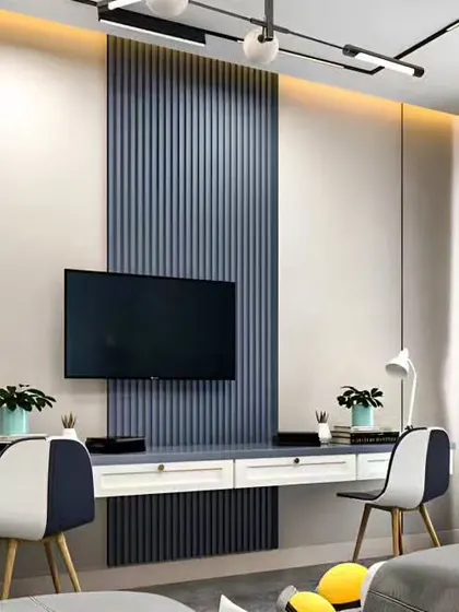 A shared study space in a bedroom, with a long desk placed against a fluted accent wall.