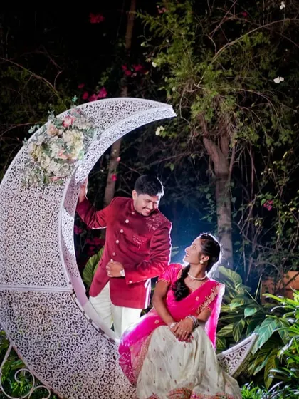 A romantic night-time pre-wedding shoot featuring a beautiful crescent moon prop, perfect for creating a dreamy and magical atmosphere.