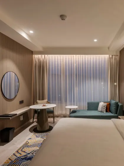 Additional views of the Radisson Resort, Khopoli, showcasing various interior and exterior details, from lobby seating areas and restaurant layouts to guest room configurations and architectural elements.