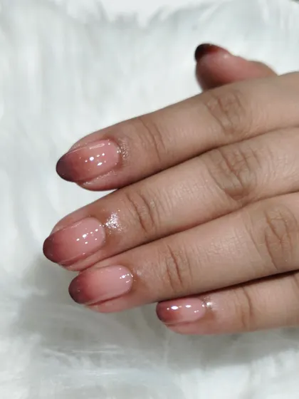 Another angle of the chic brown ombré, showcasing the glossy finish and the smooth color transition.