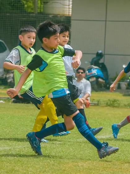 A chase for the ball shows the energy and enthusiasm of our youngest football players.