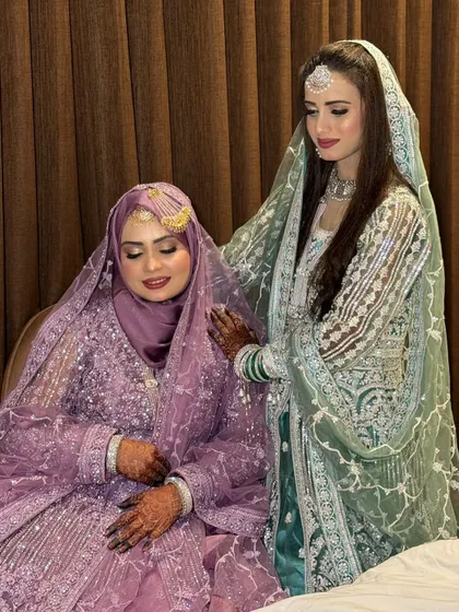 A sweet moment between the Devrani and Jethani (sisters-in-law). I did the makeup for both of these beautiful women, including the lovely Hijabi bride in the lavender outfit.