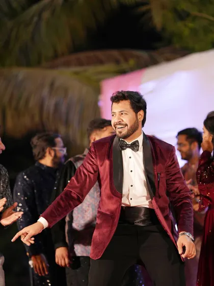 A candid moment of me enjoying the dance floor during a Sangeet reception. Dressed in a sharp velvet tuxedo, I'm ready for a night of celebration.
