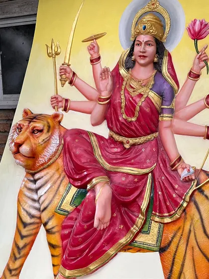 A close-up of the finished Maa Durga mural. You can see the incredible detail on the tiger and the rich, layered colors of her sari, all hand-painted.
