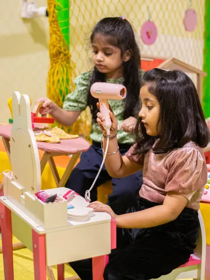 Best friends getting ready for a party at our adorable bunny-themed vanity set.