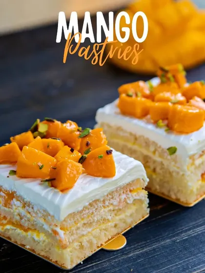 Our Mango Pastries offer a perfect single serving of our popular mango cake. They feature layers of vanilla sponge, mango cream, and are topped with fresh mango pieces.